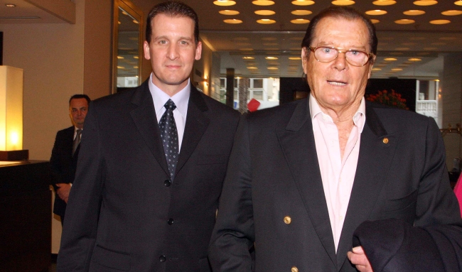 Roger Moore (right) is escorted at the Dan Tel Aviv by hotel manager Etai Eliaz. At the Fifth Eilat Chamber Music Festival, Sir Roger, a UNICEF ambassador since 1991, gave a concert dedicated to the UNICEF fight against AIDS in Africa. Photo: Yael Tzur