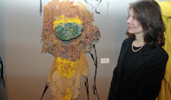 Nina Boxer inspects dress, "Childhood Fantasy," designed by Bezalel student Rotem and made of