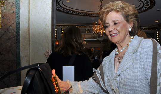 Matilda Raffa Cuomo examining designer bags