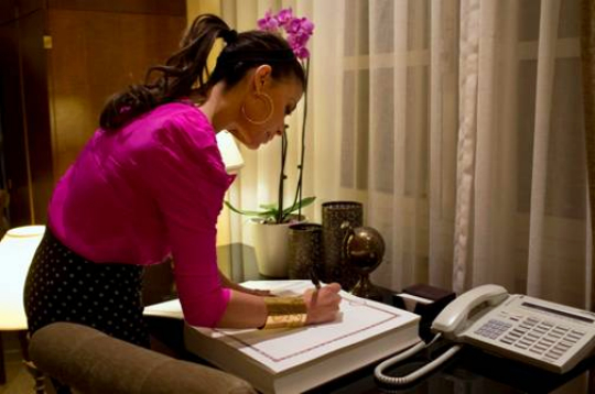 Paula Abdul signs guest book at King David Hotel in Jerusalem