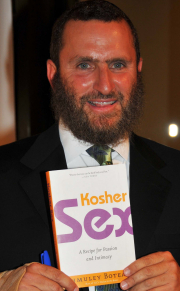 Rabbi Shmuley Boteach signs one of his more popular books