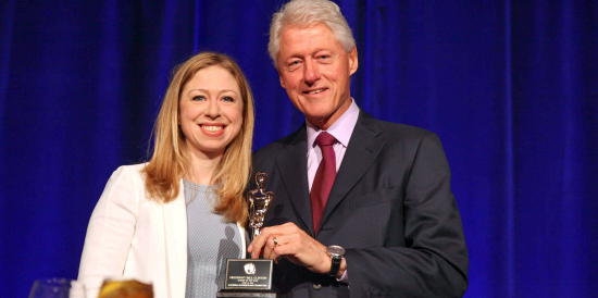 Bill Clinton accepts Father of the Year Award from his daughter Chelsea
