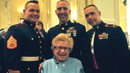 Dr. Ruth raises the morale of U.S. Marines Steve Stewart, Lee Weiner and Paul Pinaud