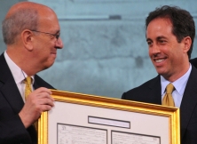 Jerry Seinfeld gets the award from Stephen A. Briganti