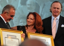 Emilio and Gloria Estefan receive awards from Robert Forbes