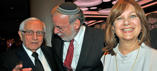 Eugen Gluck greets New York State Assemblyman Dov Hikind and Shoshana Hikind