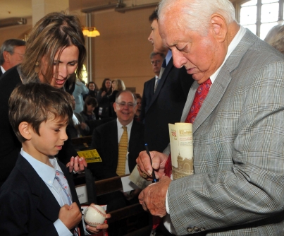 Tommy La Sorda autographing for Jacob Shufro, 9, of Riverdale Country School