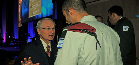 Zionist Organization of America president Mort Klein in a huddle with a Special Operations officer