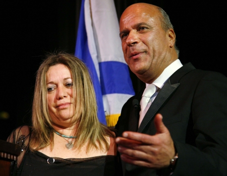 Benny Shabtai consoles Mary Dan Gor who lost a son in Gaza last year