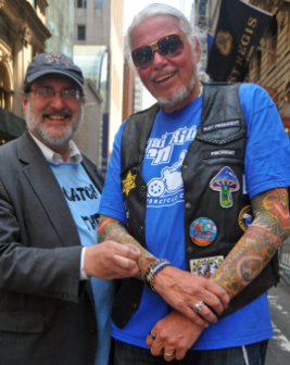 Rabbi Sholom Steinig of Young Israel of Bayside, N.Y., checks out the tattoo tee of David Himber of the Chai Riders